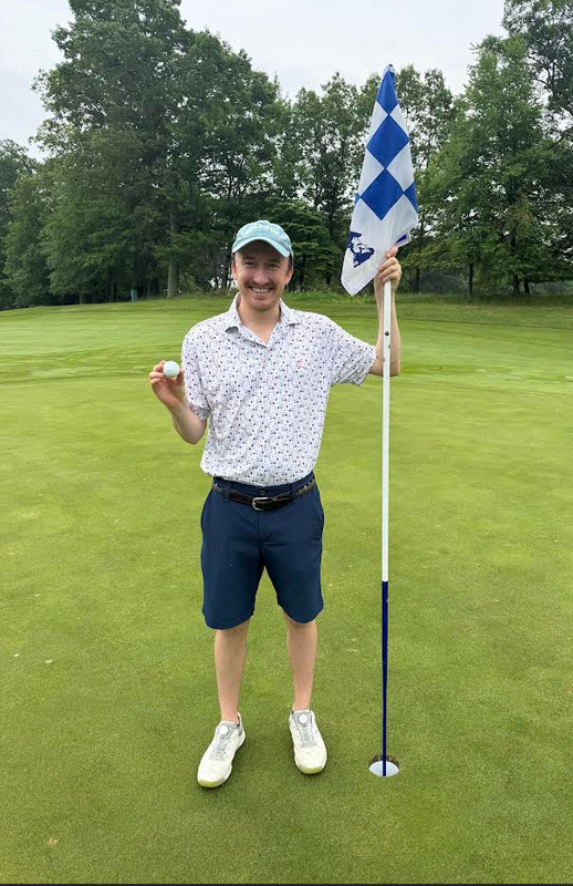 Matt Gurski at the hole after his hole-in-one at Patriot Hills Golf Club