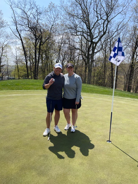 Mamo Arima at the hole after his hole-in-one at Patriot Hills Golf Club
