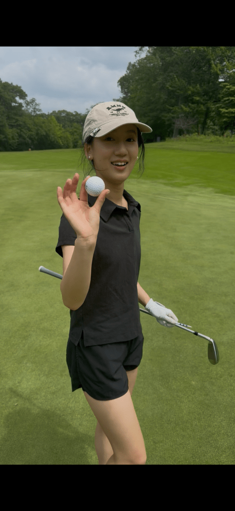 Vicky Duanyan Chen at the hole after her hole-in-one at Patriot Hills Golf Club